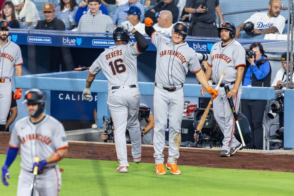 Rafael Devers #16 of the San Francisco Giants and Matt Chapman #26 of the San Francisco Giants celebrate a home run during an MLB game against the Los Angeles Dodgers at Dodger Stadium on September 20, 2025 in Los Angeles, California. Rafael Devers #16 of the San Francisco Giants and Matt Chapman #26 of the San Francisco Giants celebrate a home run during an MLB game against the Los Angeles Dodgers at Dodger Stadium on September 20, 2025 in Los Angeles, California.