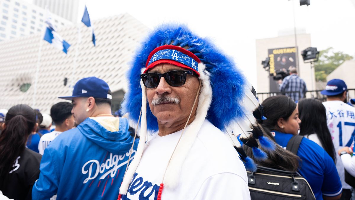 LOS ANGELES, Calif. — Nov. 3, 2025 — A Dodgers fan dressed in team colors poses for a photo during the team’s championship parade on Monday. LOS ANGELES, Calif. — Nov. 3, 2025 — A Dodgers fan dressed in team colors poses for a photo during the team’s championship parade on Monday.