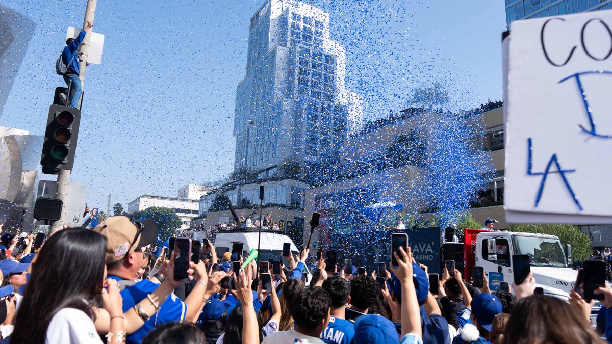 LOS ANGELES, Calif. — Nov. 3, 2025 — Confetti fills the air as fans cheer and capture photos during the Dodgers championship parade on Monday. LOS ANGELES, Calif. — Nov. 3, 2025 — Confetti fills the air as fans cheer and capture photos during the Dodgers championship parade on Monday.