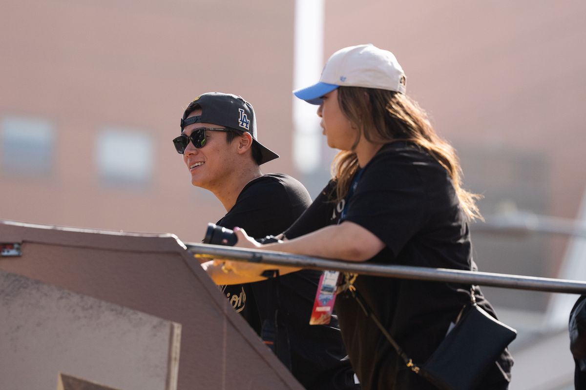 LOS ANGELES, Calif. — Nov. 3, 2025 — Dodgers pitcher Yoshinobu Yamamoto smiles while passing by fans during the team’s championship parade on Monday. LOS ANGELES, Calif. — Nov. 3, 2025 — Dodgers pitcher Yoshinobu Yamamoto smiles while passing by fans during the team’s championship parade on Monday.