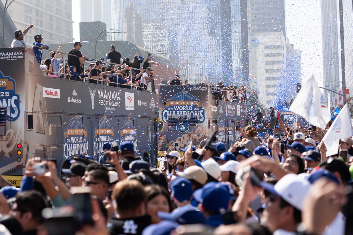LOS ANGELES, Calif. — Nov. 3, 2025 — Fans cheer as Dodgers players ride double-decker buses through downtown Los Angeles during the team’s championship parade on Monday. LOS ANGELES, Calif. — Nov. 3, 2025 — Fans cheer as Dodgers players ride double-decker buses through downtown Los Angeles during the team’s championship parade on Monday.
