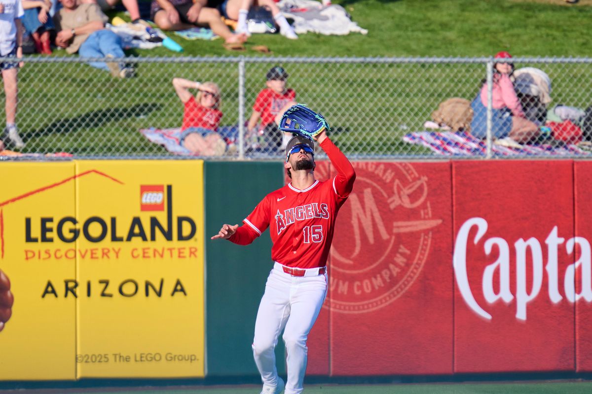 The Los Angeles angels outfielder Matthew Lugo (15) catches a pop fly against the Los Angeles Dodgers, February 21st, 2026 in Tempe Arizona. The Los Angeles angels outfielder Matthew Lugo (15) catches a pop fly against the Los Angeles Dodgers, February 21st, 2026 in Tempe Arizona.