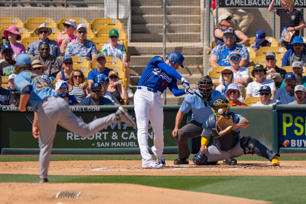 Los Angeles Dodgers first baseman Freddie Freeman (5) hitting a single during an MLB spring training baseball game against the Milwaukee Brewers on March 16th, 2026 in Glendale, AZ.