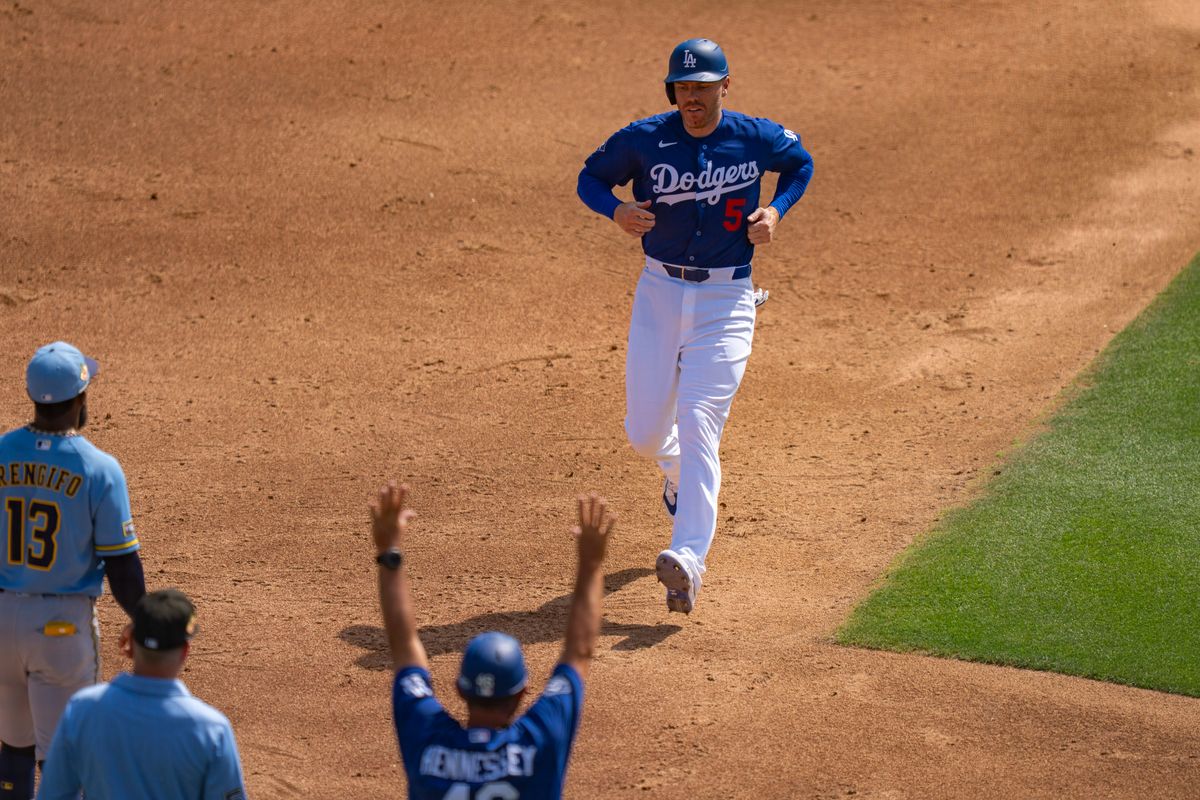 Los Angeles Dodgers first baseman Freddie Freeman (5) running to home plate off a Teoscar Hernandez homerun during an MLB spring training baseball game against the Milwaukee Brewers on March 16th, 2026 in Glendale, AZ.