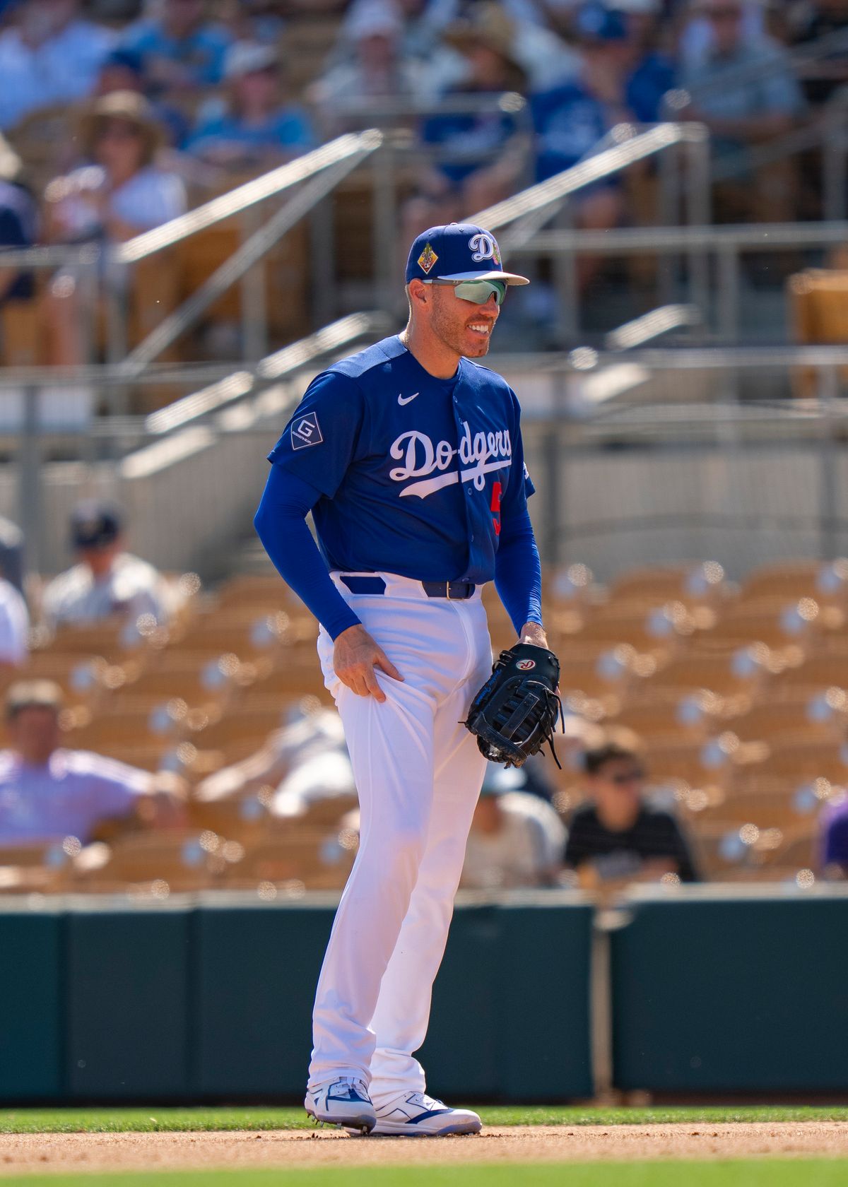 Los Angeles Dodgers first baseman Freddie Freeman (5) smiling after tagging a runner during an MLB spring training baseball game against the Milwaukee Brewers on March 16th, 2026 in Glendale, AZ.