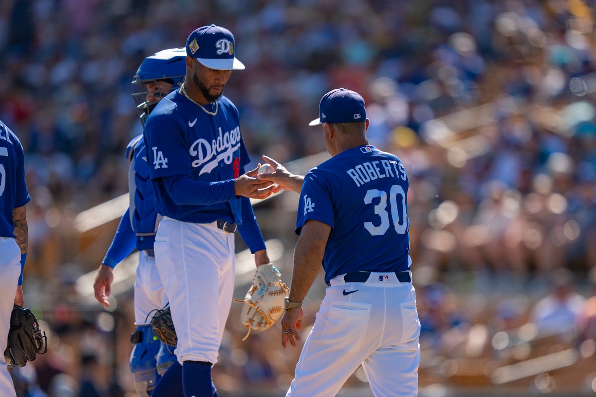 Los Angeles Dodgers pitcher Jerming Rosario (81) being relieved by manager Dave Roberts during an MLB spring training baseball game against the Milwaukee Brewers on March 16th, 2026 in Glendale, AZ.