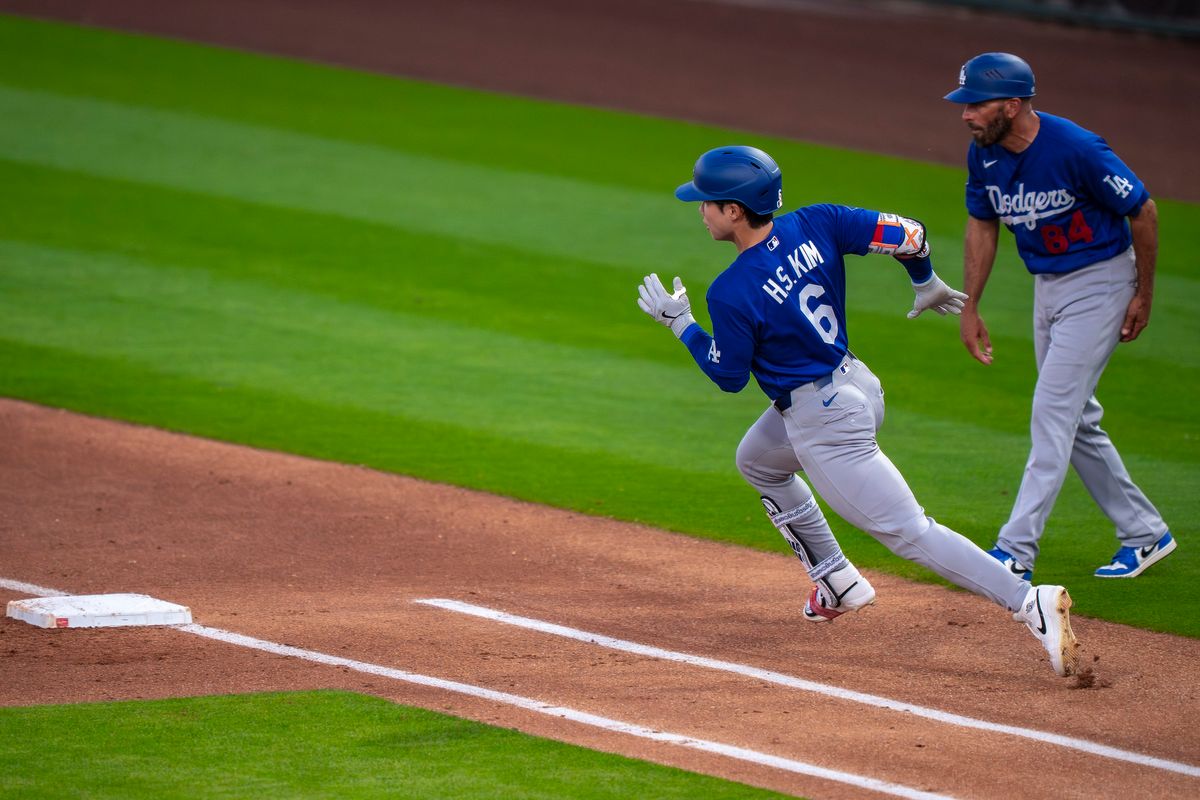 Los Angeles Dodgers shortstop Hyeseon Kim (6) rounding first base after a hit during an MLB spring training baseball game against the Kansas City Royals on March 17th, 2026 in Surprise, AZ.