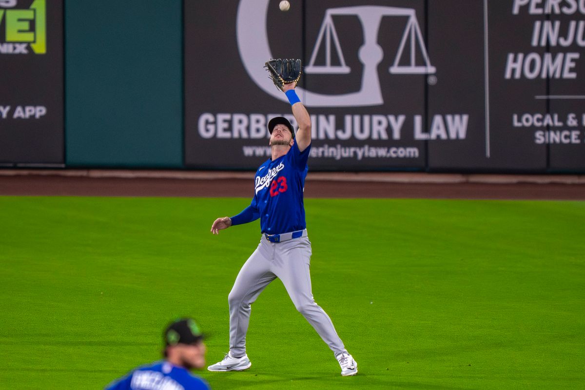 Los Angeles Dodgers outfielder Kyle Tucker (23)catching a fly out during an MLB spring training baseball game against the Kansas City Royals on March 17th, 2026 in Surprise, AZ.