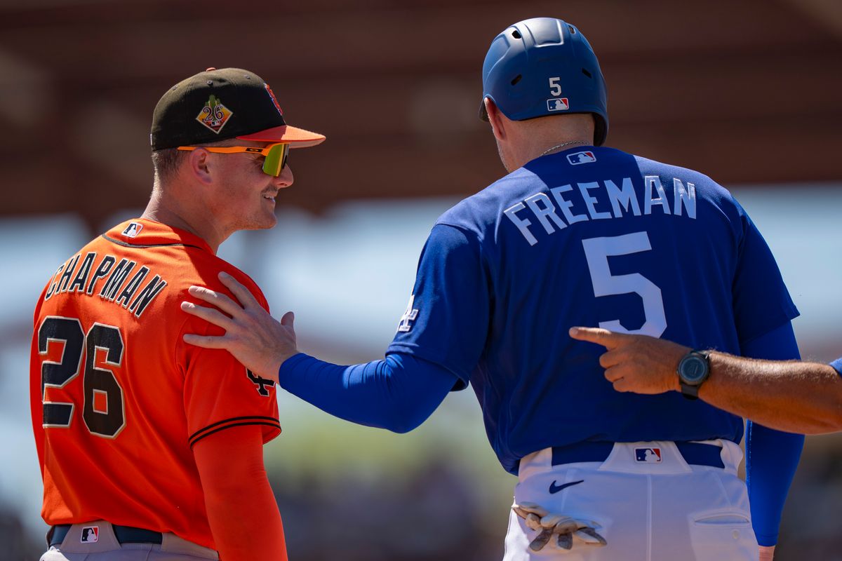 Los Angeles Dodgers first baseman Freddie Freeman (5) greeting an opponent after singling during an MLB spring training baseball game against the San Fransisco Giants on March 18th, 2026 in Glendale, AZ.