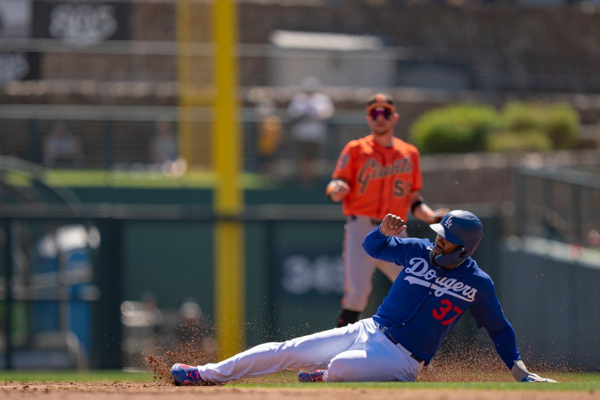 Los Angeles Dodgers outfielder Teoscar Hernandez (37) sliding into second base during an MLB spring training baseball game against the San Fransisco Giants on March 18th, 2026 in Glendale, AZ.