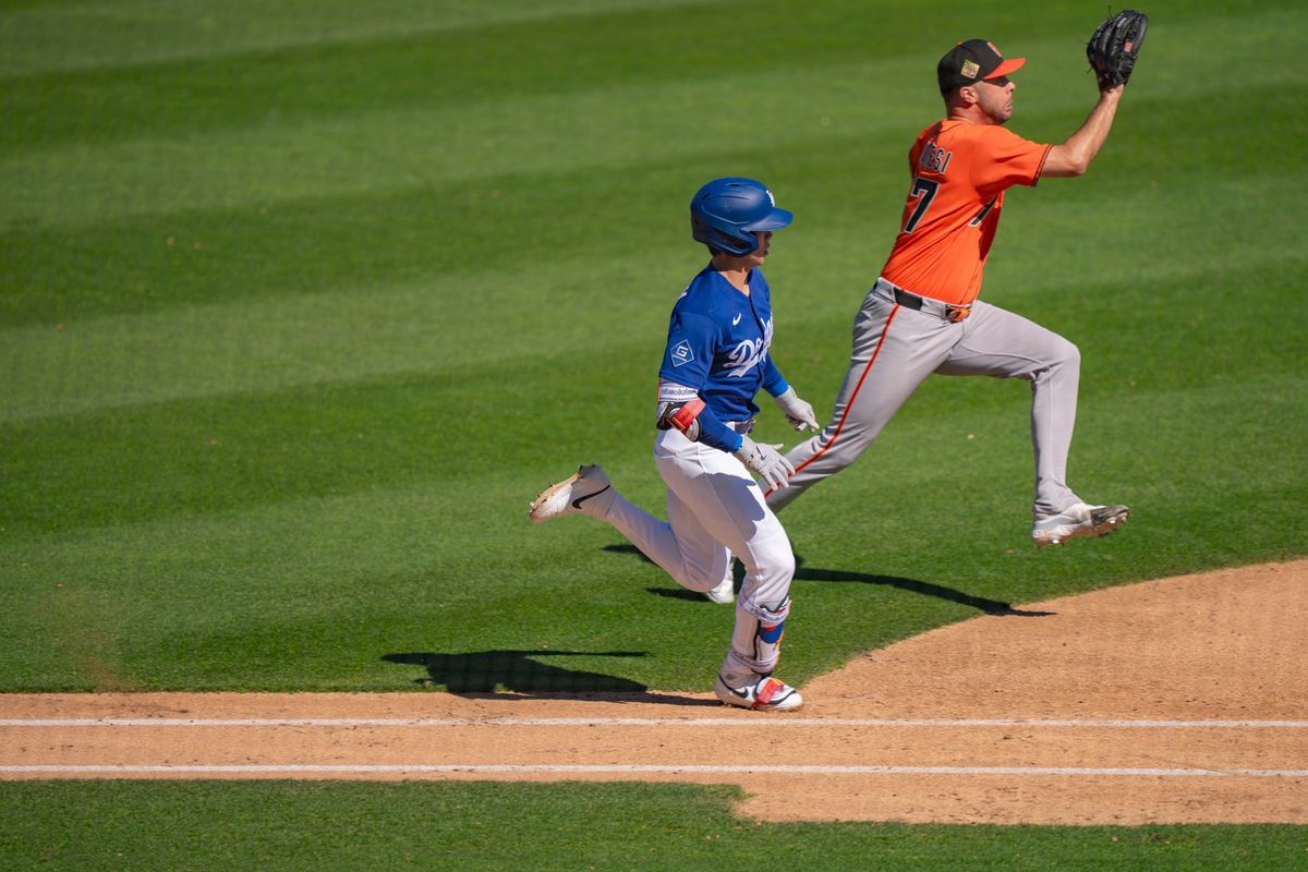 Los Angeles Dodgers shortstop Hyeseong Kim (6) racing to first after hitting a fly ball during an MLB spring training baseball game against the San Fransisco Giants on March 18th, 2026 in Glendale, AZ.