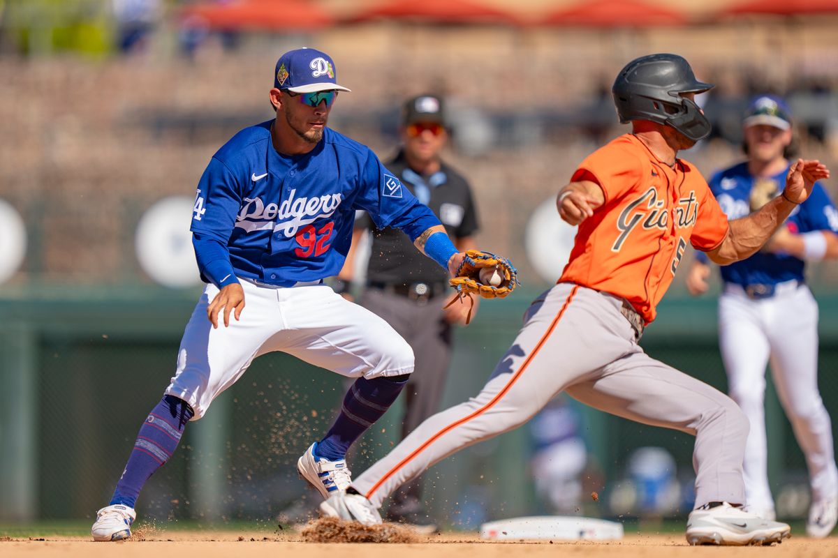 Los Angeles Dodgers second baseman Nico Perez (92) tagging a runner out during an MLB spring training baseball game against the San Fransisco Giants on March 18th, 2026 in Glendale, AZ.