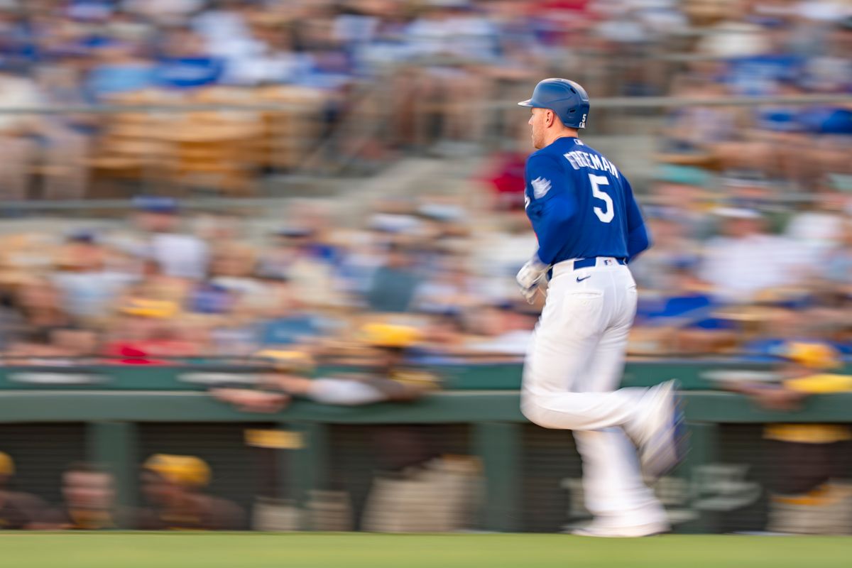Los Angeles Dodgers first baseman Freddie Freeman (5) running to first base during an MLB spring training baseball game against the San Diego Padres on March 20th, 2026 in Glendale, AZ. Los Angeles Dodgers first baseman Freddie Freeman (5) running to first base during an MLB spring training baseball game against the San Diego Padres on March 20th, 2026 in Glendale, AZ.