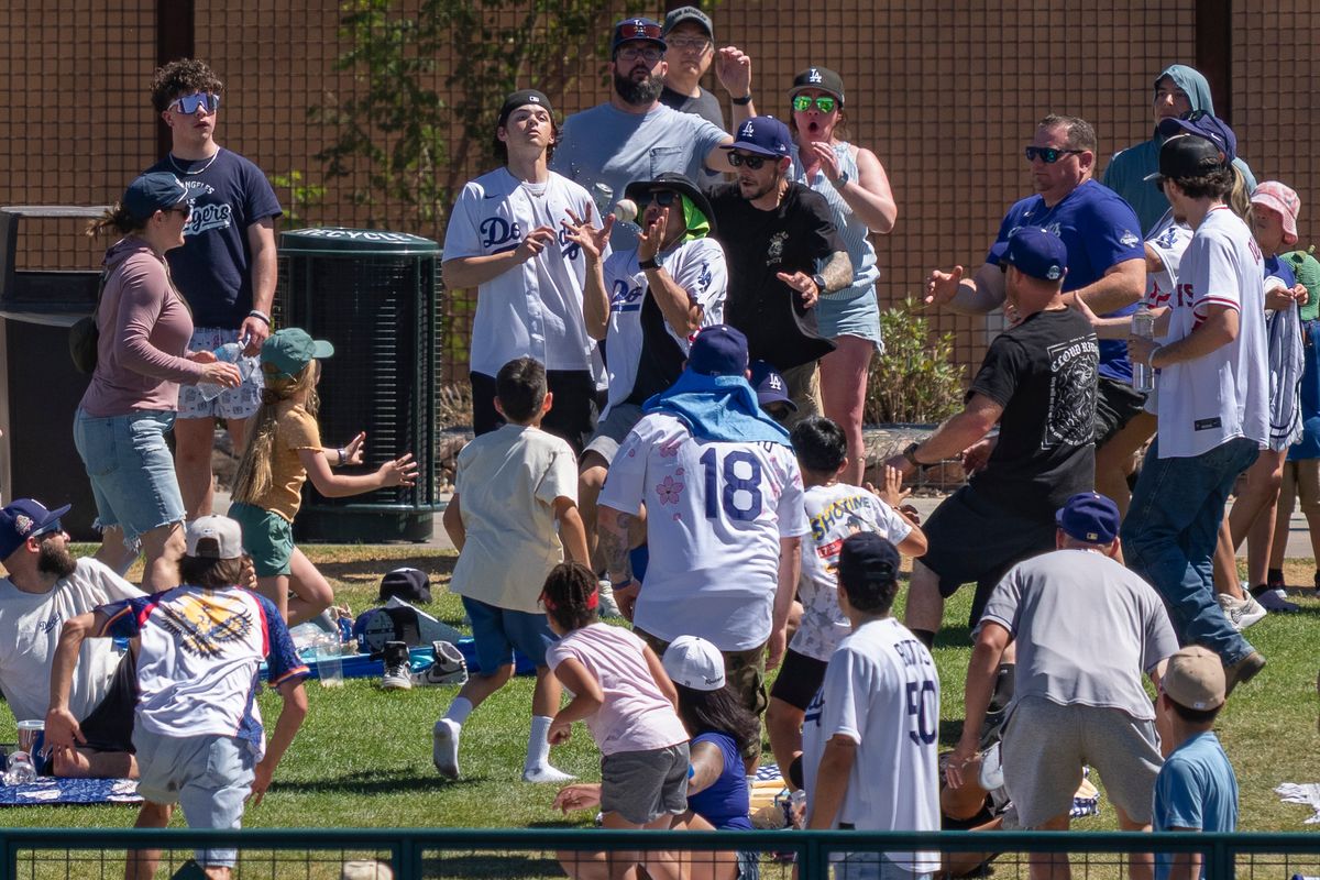 Los Angeles Dodgers fans catch a home run during an MLB spring training baseball game against the Las Vegas A’s on March 21st, 2026 in Glendale, AZ. Los Angeles Dodgers fans catch a home run during an MLB spring training baseball game against the Las Vegas A’s on March 21st, 2026 in Glendale, AZ.