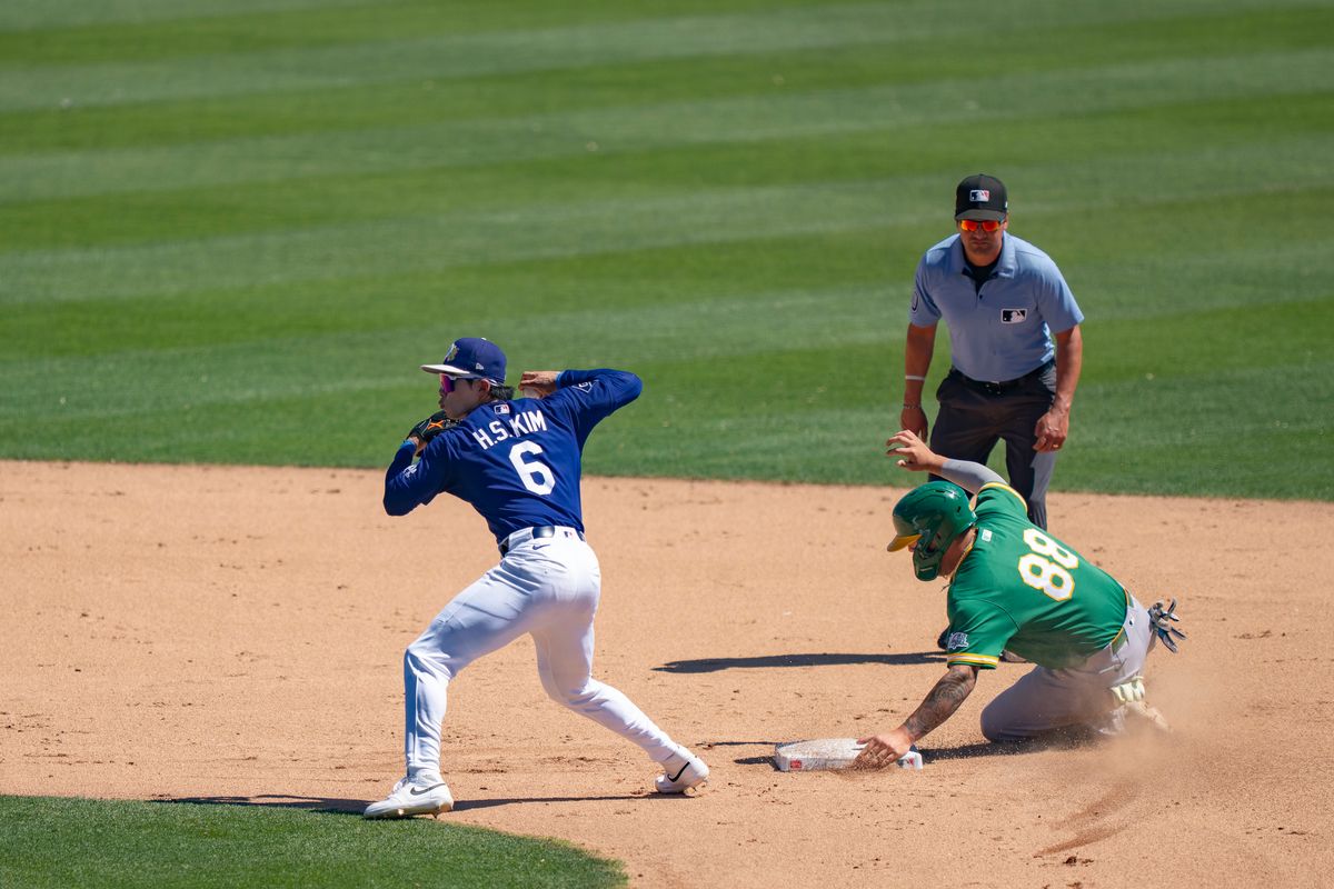 Los Angeles Dodgers shortstop Hyeseong Kim (6) ignoring second base and throwing to first base to end the inning during an MLB spring training baseball game against the Las Vegas A’s on March 21st, 2026 in Glendale, AZ. Los Angeles Dodgers shortstop Hyeseong Kim (6) ignoring second base and throwing to first base to end the inning during an MLB spring training baseball game against the Las Vegas A’s on March 21st, 2026 in Glendale, AZ.
