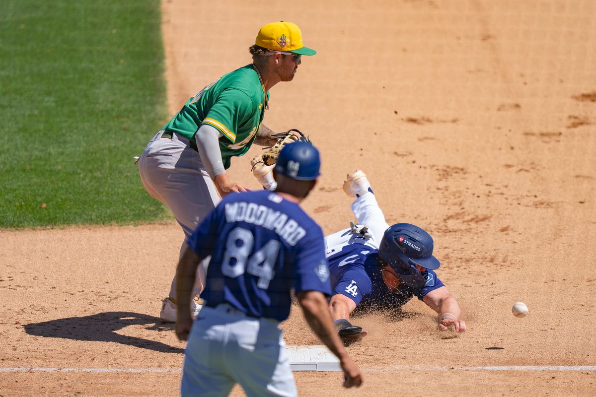 Los Angeles Dodgers infielder Joe Vetrano (95) sliding into first base safely due to an athletics error during an MLB spring training baseball game against the Las Vegas A’s on March 21st, 2026 in Glendale, AZ. Los Angeles Dodgers infielder Joe Vetrano (95) sliding into first base safely due to an athletics error during an MLB spring training baseball game against the Las Vegas A’s on March 21st, 2026 in Glendale, AZ.