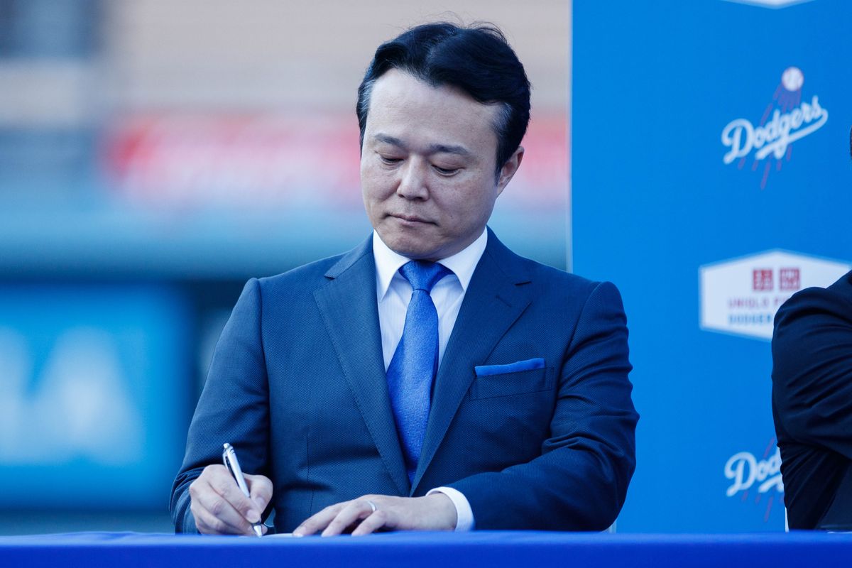 UNIQLO COO Daisuke Tsukagoshi takes notes during a UNIQLO partnership press conference on March 25, 2026 in Los Angeles, California.