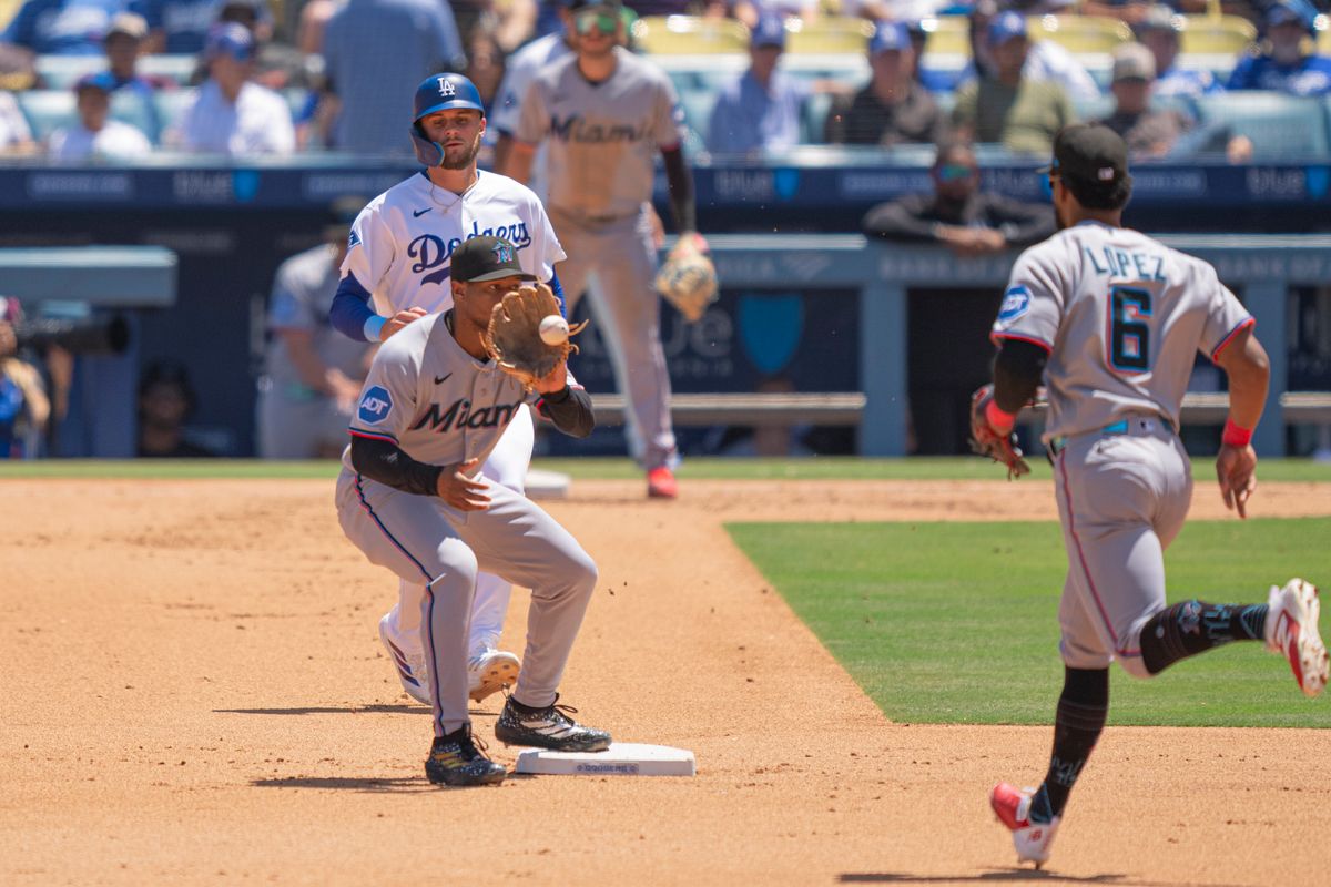 Miami Marlins infielder Xavier Edwards (19) tagging second base for an out during an MLB baseball game against the Los Angeles Dodgers on April 29th, 2026 in Los Angeles, CA.