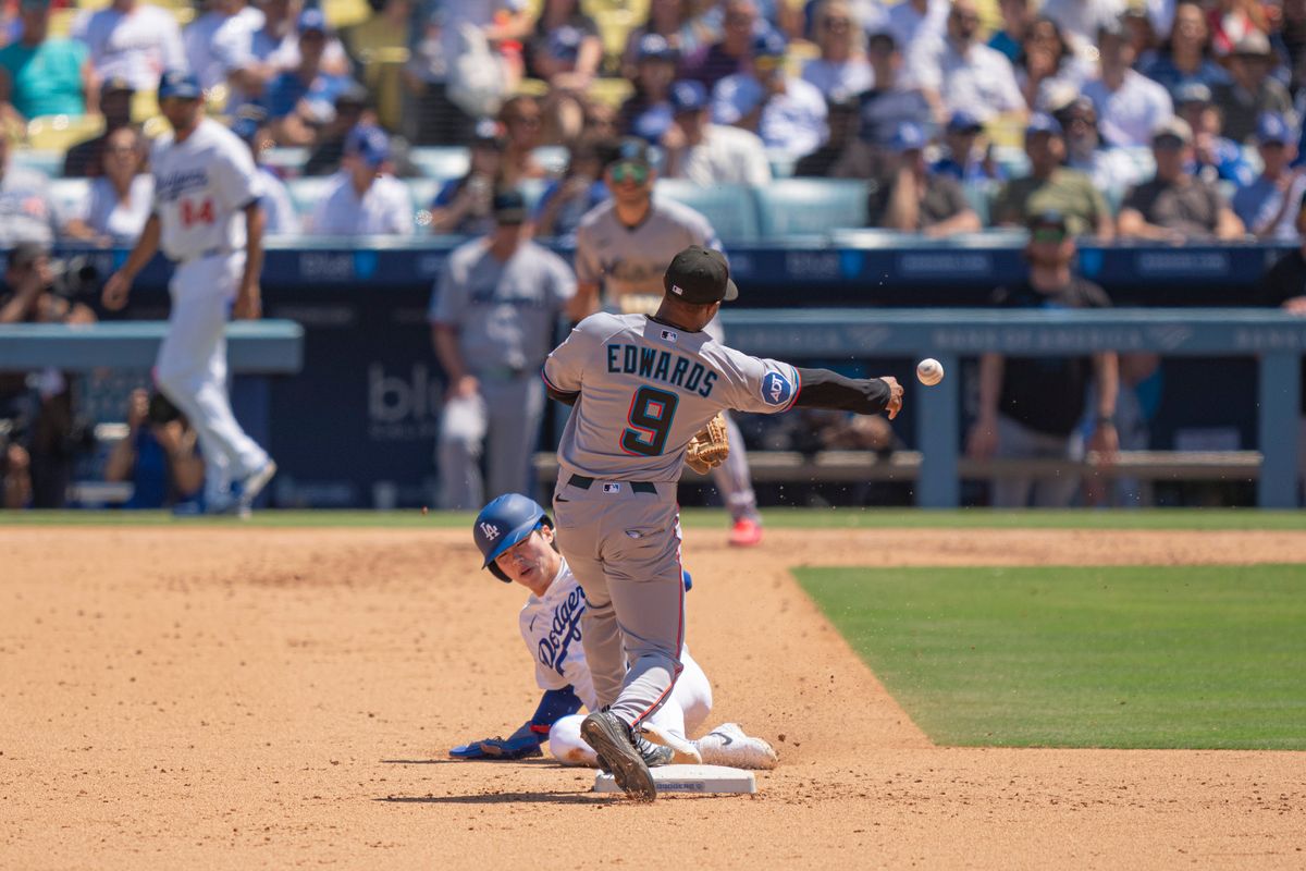 Miami Marlins infielder Xavier Edwards (9) making a double play during an MLB baseball game against the Los Angeles Dodgers on April 29th, 2026 in Los Angeles, CA.