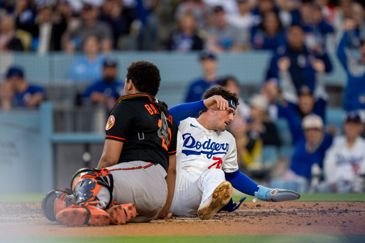 Los Angeles Dodgers infielder Alex Freeland (76) slides into home safely during an MLB baseball game against the Baltimore Orioles on June 19th, 2026 in Los Angeles, CA.
