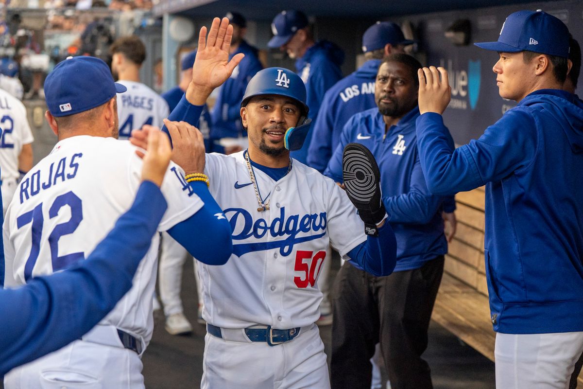 Los Angeles Dodgers infielder Mookie Betts (50) celebrates a run in the dugout during an MLB baseball game against the Baltimore Orioles on June 19th, 2026 in Los Angeles, CA.