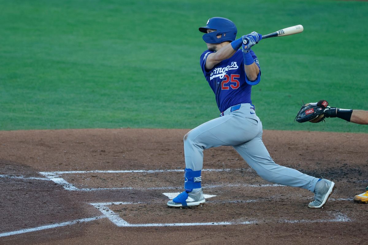 Tommy Edman #25 of the Los Angeles Dodgers hits a three-run home run against the Athletics at Sutter Health Park on June 30, 2026 in Sacramento, California.