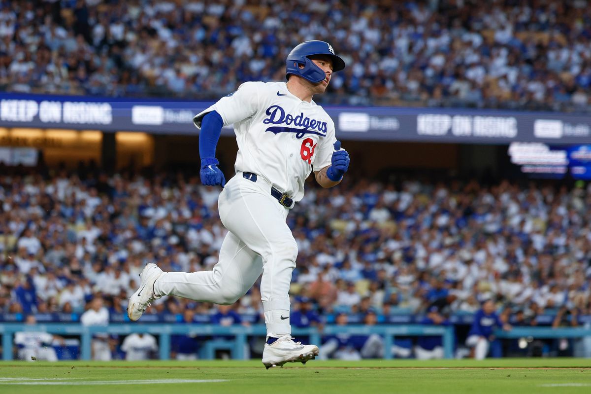 Dalton Rushing #68 of the Los Angeles Dodgers hits a double against the Colorado Rockies at Dodger Stadium on July 06, 2026 in Los Angeles, California. Dalton Rushing #68 of the Los Angeles Dodgers hits a double against the Colorado Rockies at Dodger Stadium on July 06, 2026 in Los Angeles, California.