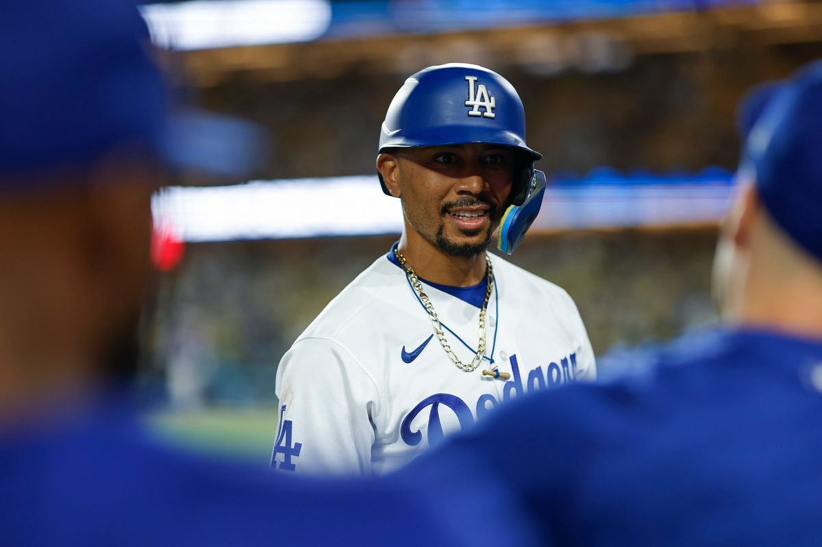 Mookie Betts #50 of the Los Angeles Dodgers talks to teammates against the Colorado Rockies at Dodger Stadium on July 06, 2026 in Los Angeles, California. Mookie Betts #50 of the Los Angeles Dodgers talks to teammates against the Colorado Rockies at Dodger Stadium on July 06, 2026 in Los Angeles, California.