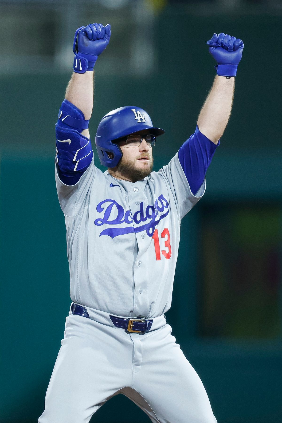 Max Muncy #13 of the Los Angeles Dodgers celebrates at second base against the Philadelphia Phillies at Citizens Bank Park on July 20, 2026 in Philadelphia, Pennsylvania.