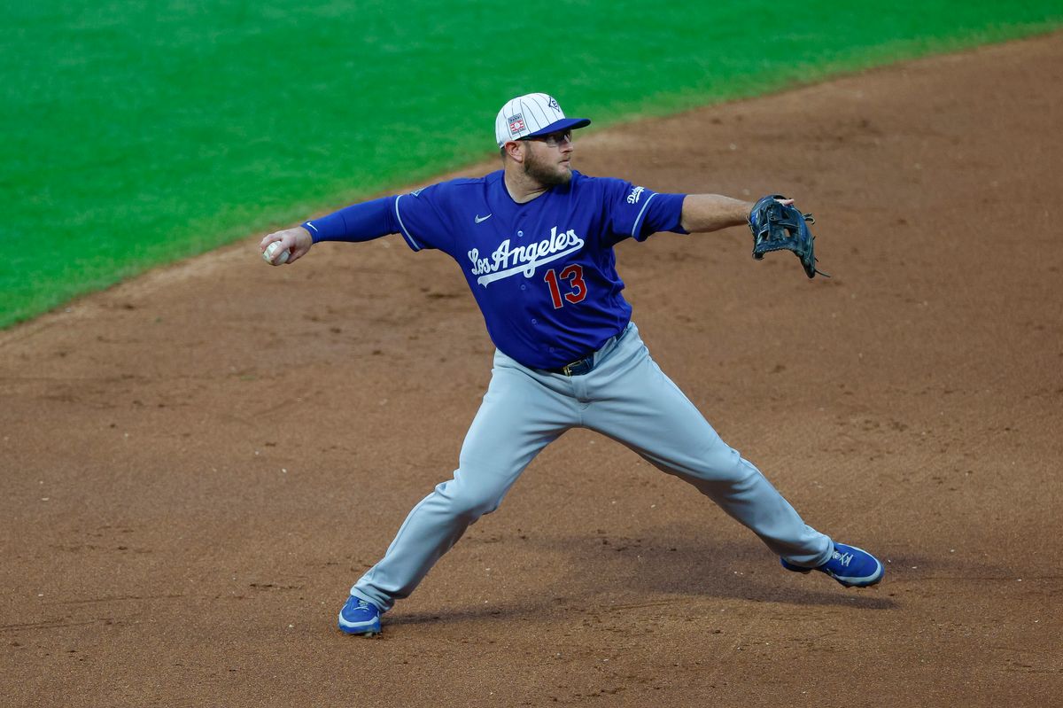 Max Muncy #13 of the Los Angeles Dodgers throws to first base against the New York Mets at Citi Field on July 25, 2026 in New York, New York. Max Muncy #13 of the Los Angeles Dodgers throws to first base against the New York Mets at Citi Field on July 25, 2026 in New York, New York.