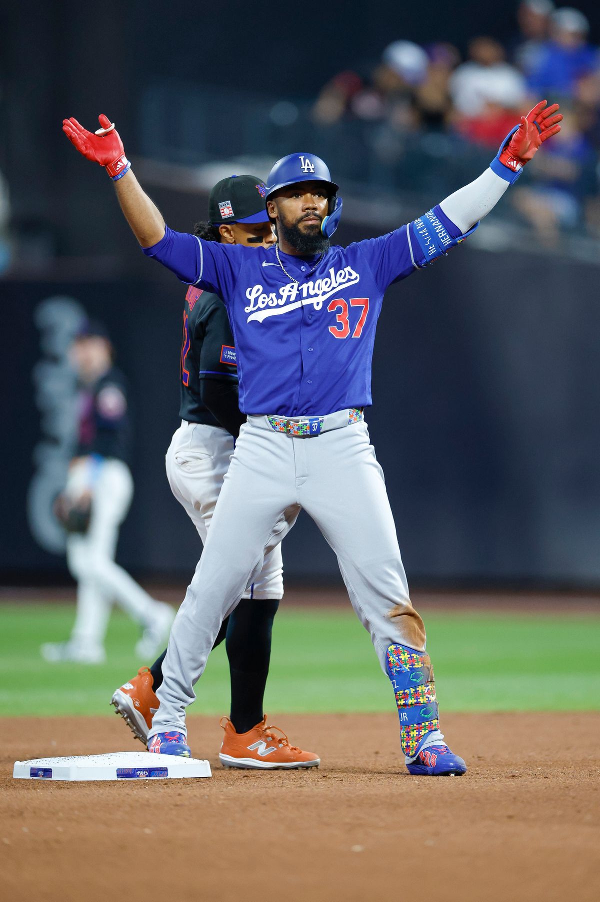 Teoscar Hernandez #37 of the Los Angeles Dodgers celebrates at second base against the New York Mets at Citi Field on July 25, 2026 in New York, New York. Teoscar Hernandez #37 of the Los Angeles Dodgers celebrates at second base against the New York Mets at Citi Field on July 25, 2026 in New York, New York.