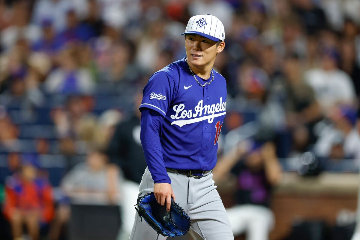 Yoshinobu Yamamoto #18 of the Los Angeles Dodgers smiles on the field against the New York Mets at Citi Field on July 25, 2026 in New York, New York. Yoshinobu Yamamoto #18 of the Los Angeles Dodgers smiles on the field against the New York Mets at Citi Field on July 25, 2026 in New York, New York.