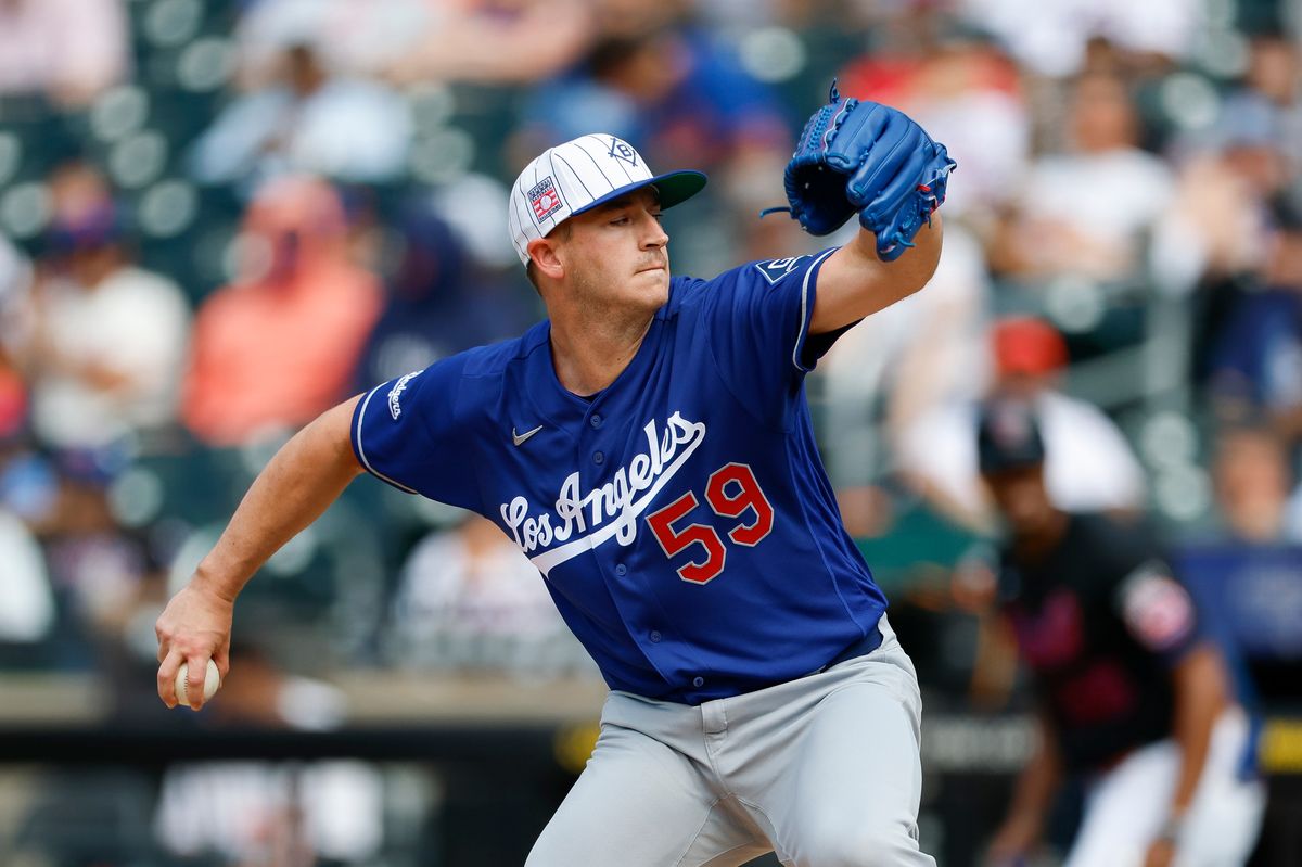 Evan Phillips #59 of the Los Angeles Dodgers pitches against the New York Mets at Citi Field on July 26, 2026 in New York, New York. Evan Phillips #59 of the Los Angeles Dodgers pitches against the New York Mets at Citi Field on July 26, 2026 in New York, New York.