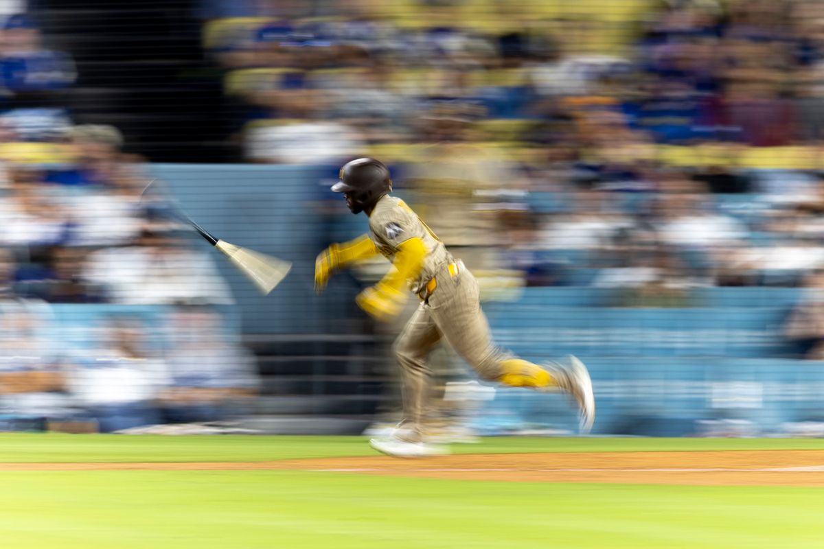 San Diego Padres left fielder Samad Taylor (0) throws the bat and runs to first base during a MLB baseball game against the Los Angeles Dodgers, Tuesday September 22, 2026 in Los Angeles, California. San Diego Padres left fielder Samad Taylor (0) throws the bat and runs to first base during a MLB baseball game against the Los Angeles Dodgers, Tuesday September 22, 2026 in Los Angeles, California.