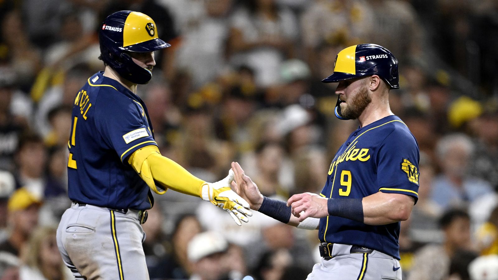 Oct 7, 2026; San Diego, California, USA; Milwaukee Brewers first baseman Jake Bauers (9) celebrates with Milwaukee Brewers center fielder Garrett Mitchell (5) after scoring a run during the sixth inning against the San Diego Padres in game four of the NLDS for the 2026 MLB Playoffs at Petco Park. Oct 7, 2026; San Diego, California, USA; Milwaukee Brewers first baseman Jake Bauers (9) celebrates with Milwaukee Brewers center fielder Garrett Mitchell (5) after scoring a run during the sixth inning against the San Diego Padres in game four of the NLDS for the 2026 MLB Playoffs at Petco Park.