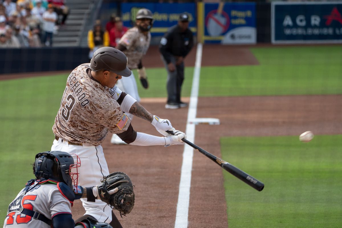 San Diego Padres Third Baseman, Manny Machado (13), hits an RBI double in the first inning during an MLB Baseball game against the Atlanta Braves at Petco Park in San Diego, CA, on March 30, 2025. San Diego Padres Third Baseman, Manny Machado (13), hits an RBI double in the first inning during an MLB Baseball game against the Atlanta Braves at Petco Park in San Diego, CA, on March 30, 2025.