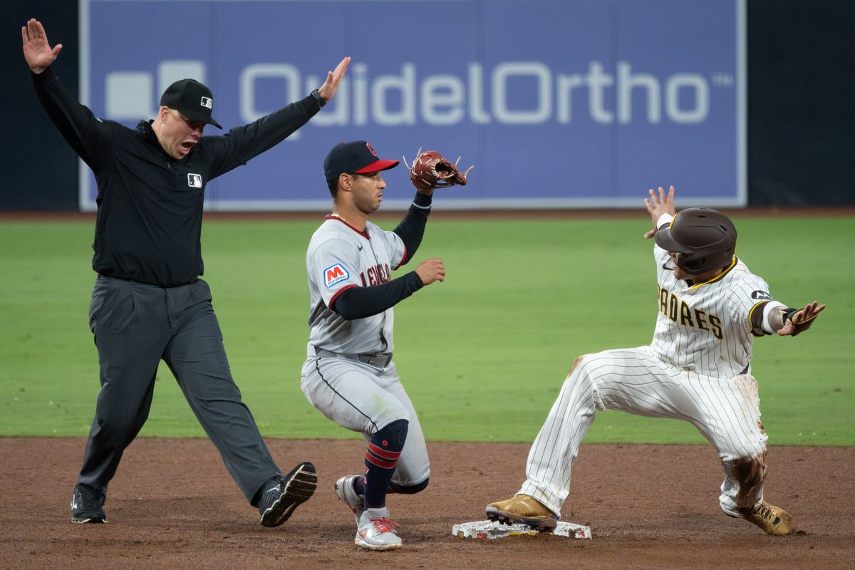 San Diego Padres Third Baseman, Manny Machado (13), gestures safe after stealing second base during an MLB Baseball game against the Cleveland Guardians at Petco Park in San Diego, CA, on March 31, 2025. San Diego Padres Third Baseman, Manny Machado (13), gestures safe after stealing second base during an MLB Baseball game against the Cleveland Guardians at Petco Park in San Diego, CA, on March 31, 2025.