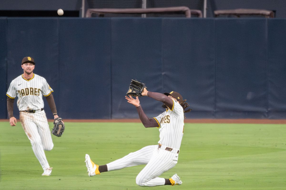 San Diego Padres Outfielder, Fernando Tatis Jr. (23), makes a sliding catch during an MLB Baseball game against the Cleveland Guardians at Petco Park in San Diego, CA, on March 31, 2025. San Diego Padres Outfielder, Fernando Tatis Jr. (23), makes a sliding catch during an MLB Baseball game against the Cleveland Guardians at Petco Park in San Diego, CA, on March 31, 2025.