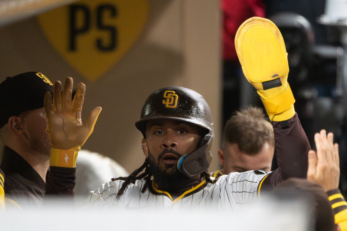 San Diego Padres Right Fielder, Fernando Tatis Jr. (23), high-fives his teammates after scoring against the Cleveland Guardians during an MLB Baseball game at Petco Park in San Diego, CA, on April 1, 2025. San Diego Padres Right Fielder, Fernando Tatis Jr. (23), high-fives his teammates after scoring against the Cleveland Guardians during an MLB Baseball game at Petco Park in San Diego, CA, on April 1, 2025.