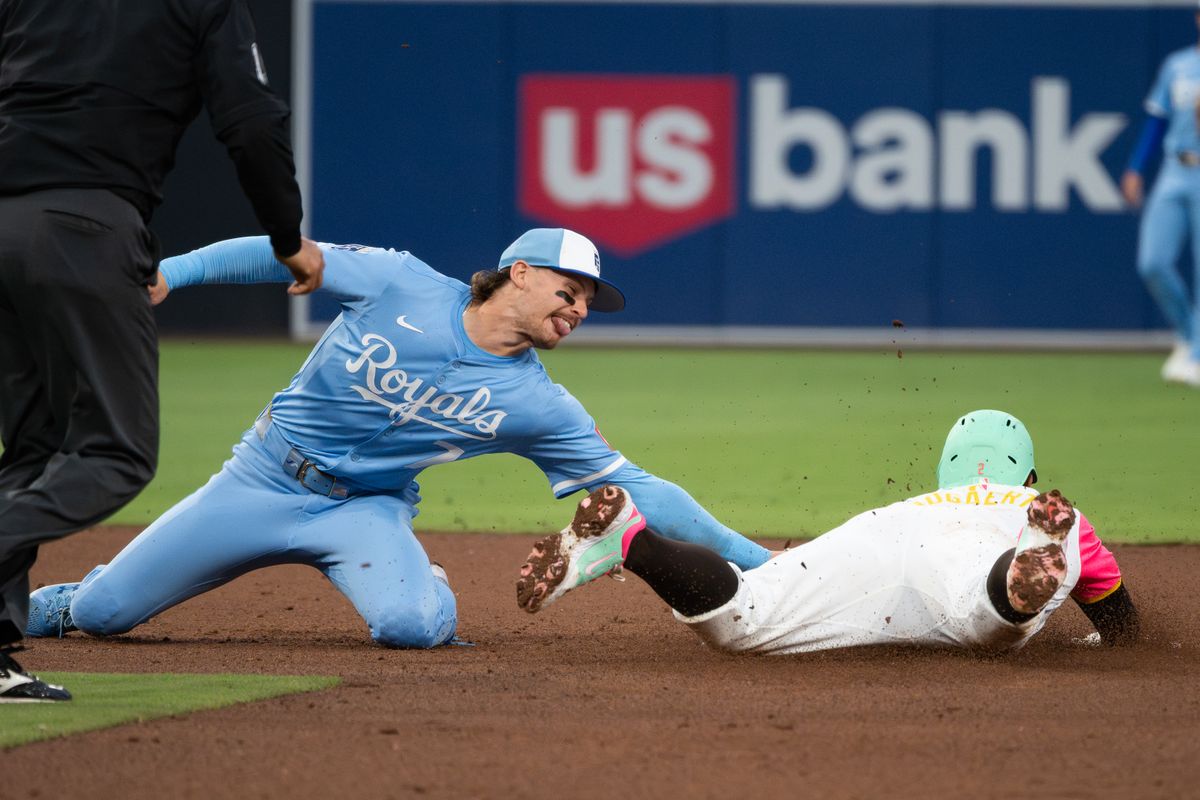 Kansas City Royals shortstop Bobby Witt Jr. (7) tags out San Diego Padres shortstop Xander Bogaerts (2) during an MLB game on June 20, 2025 at Petco Park in San Diego, CA.