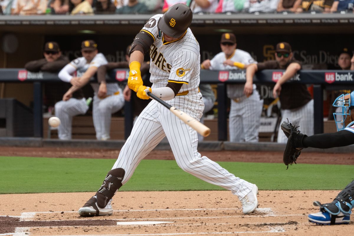 San Diego Padres outfielder Gavin Sheets (8) hits the ball during an MLB game against the Kansas City Royals on June 21, 2025 at Petco Park in San Diego, CA.