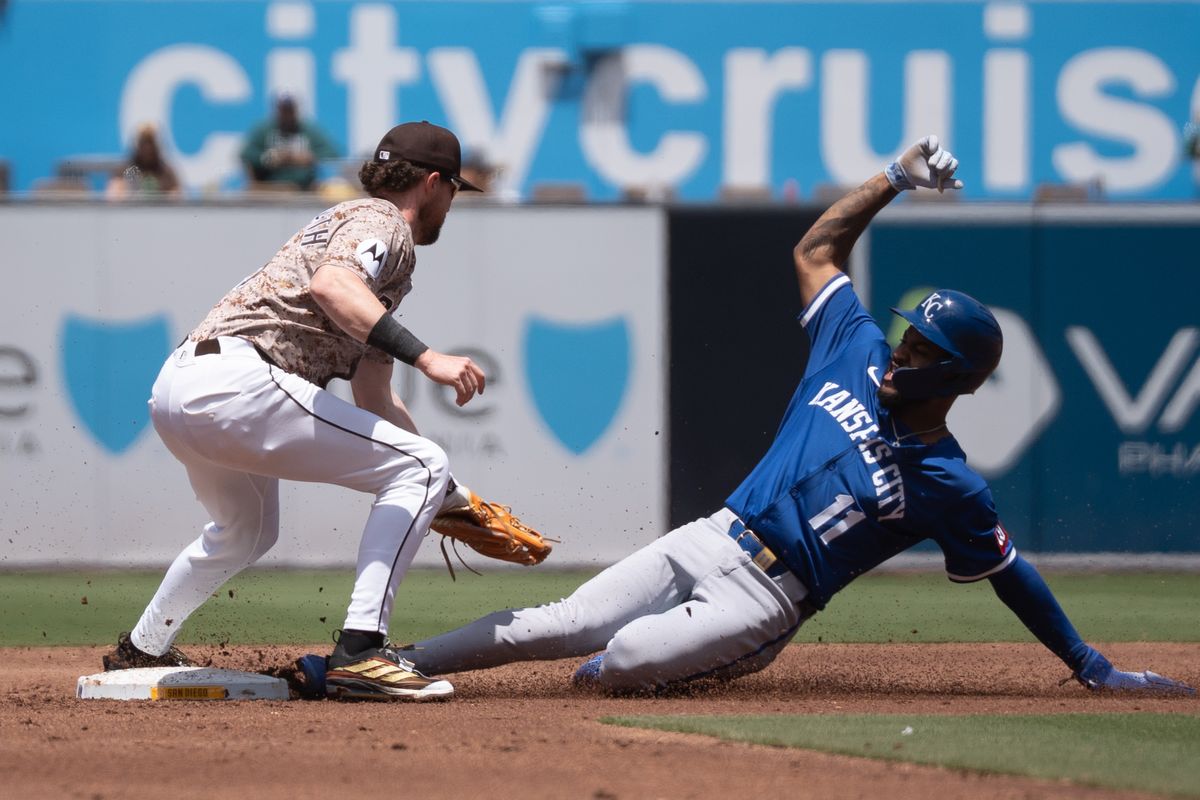 San Diego Padres infielder Jake Cronenworth (9) tags Kansas City Royals infielder Maikel Garcia (11) during an MLB game on June 22, 2025 at Petco Park in San Diego, CA. San Diego Padres infielder Jake Cronenworth (9) tags Kansas City Royals infielder Maikel Garcia (11) during an MLB game on June 22, 2025 at Petco Park in San Diego, CA.