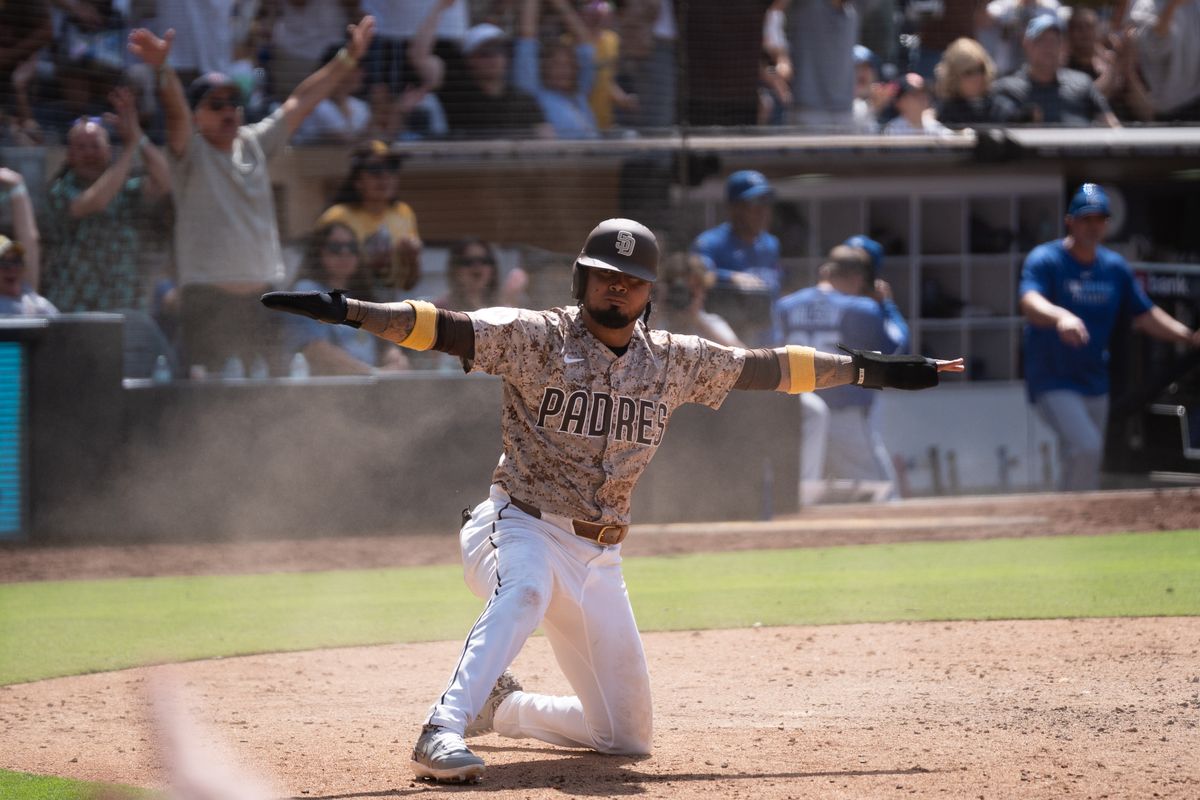 San Diego Padres infielder Luis Arraez (3) signals safe after scoring the winning run during an MLB game against the Kansas City Royals on June 22, 2025 at Petco Park in San Diego, CA. San Diego Padres infielder Luis Arraez (3) signals safe after scoring the winning run during an MLB game against the Kansas City Royals on June 22, 2025 at Petco Park in San Diego, CA.