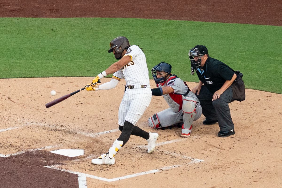 San Diego Padres outfielder Fernando Tatis Jr. (23) hits the ball during an MLB game against the Washington Nationals on June 23, 2025 at Petco Park in San Diego, CA.