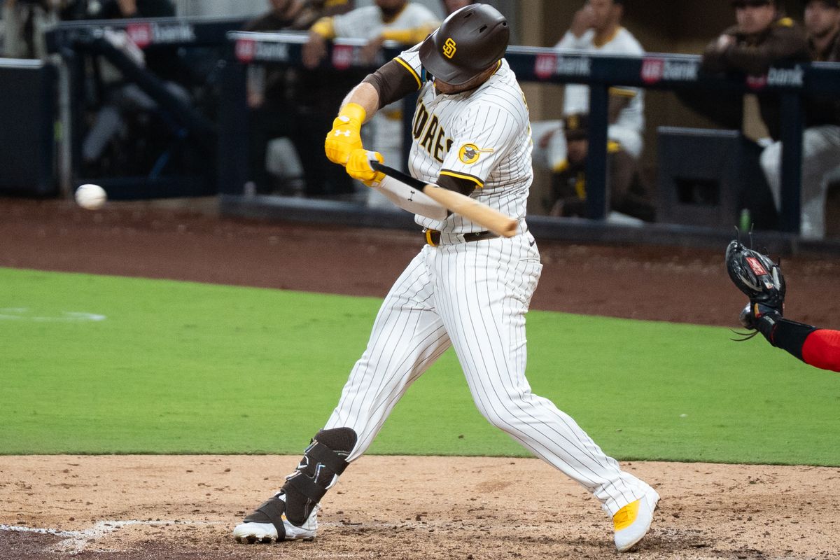 San Diego Padres outfielder Gavin Sheets (8) hits the ball during an MLB game against the Washington Nationals on June 23, 2025 at Petco Park in San Diego, CA.