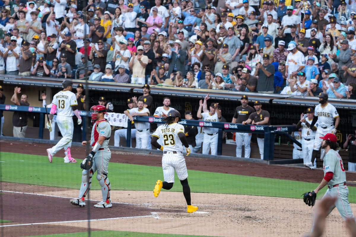 San Diego Padres Right fielder Fernando Tatis Jr. #23 scoring a run during a game against the Philadelphia Phillies on July 12, 2025 in San Diego, CA. San Diego Padres Right fielder Fernando Tatis Jr. #23 scoring a run during a game against the Philadelphia Phillies on July 12, 2025 in San Diego, CA.
