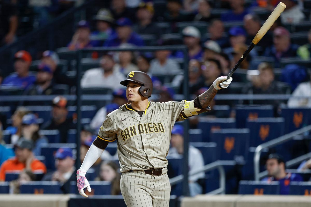Manny Machado #13 hits a grand slam against the Mets at Citi Field on September 17, 2025 in New York.