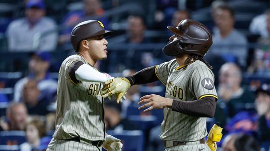 Manny Machado #13 hits a grand slam against the Mets at Citi Field on September 17, 2025 in New York.