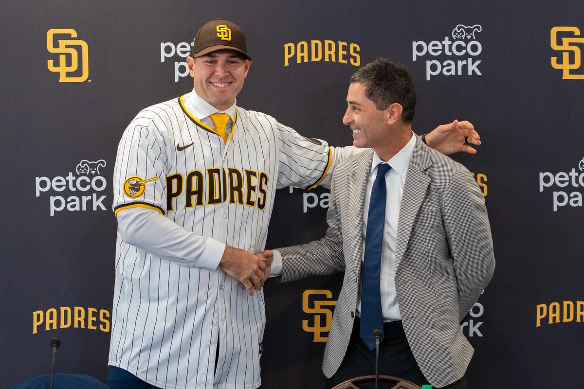 Craig Stammen shakes hands with Padres General Manager A.J. Preller as Stammen is introduced as the new Padres manager, Monday November 10, 2025 in San Diego, Calif.