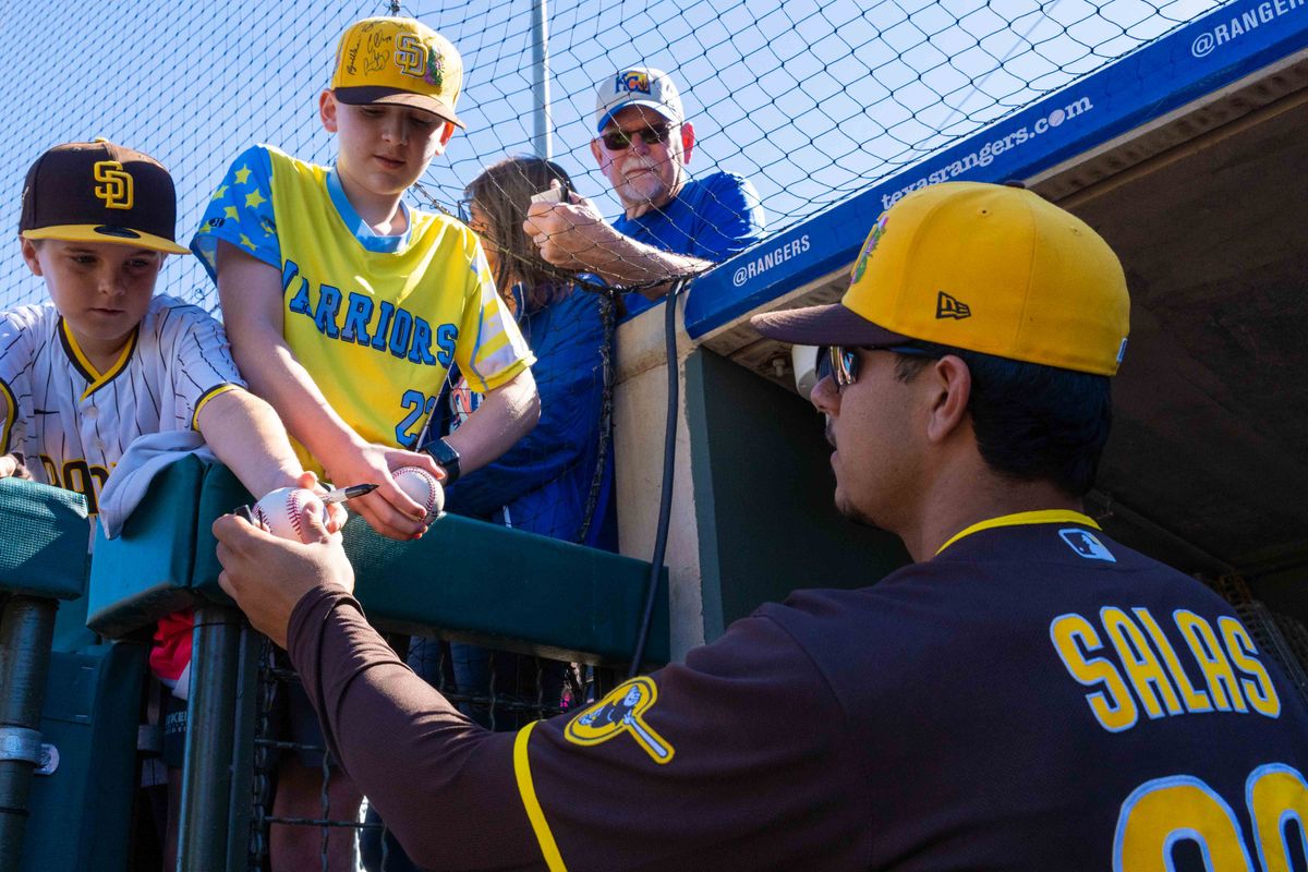 San Diego Padres catcher Ethan Salas (90) signs autographs before an MLB Spring Training game between the San Diego Padres and the Kansas City Royals, Saturday February 21, 2026 at Surprise Stadium in Surprise, AZ. San Diego Padres catcher Ethan Salas (90) signs autographs before an MLB Spring Training game between the San Diego Padres and the Kansas City Royals, Saturday February 21, 2026 at Surprise Stadium in Surprise, AZ.
